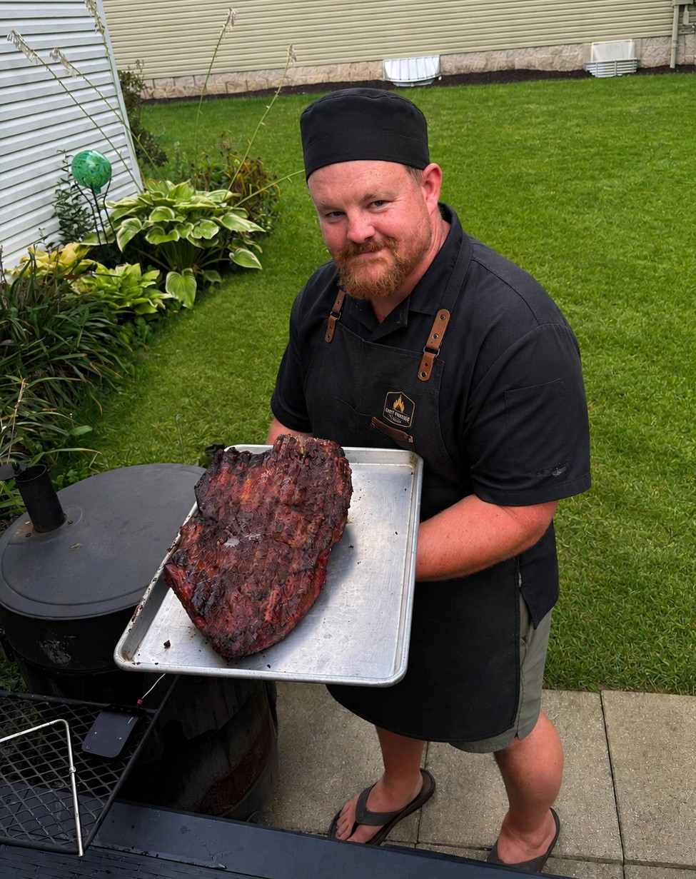 Chef Cody cooking over open fire